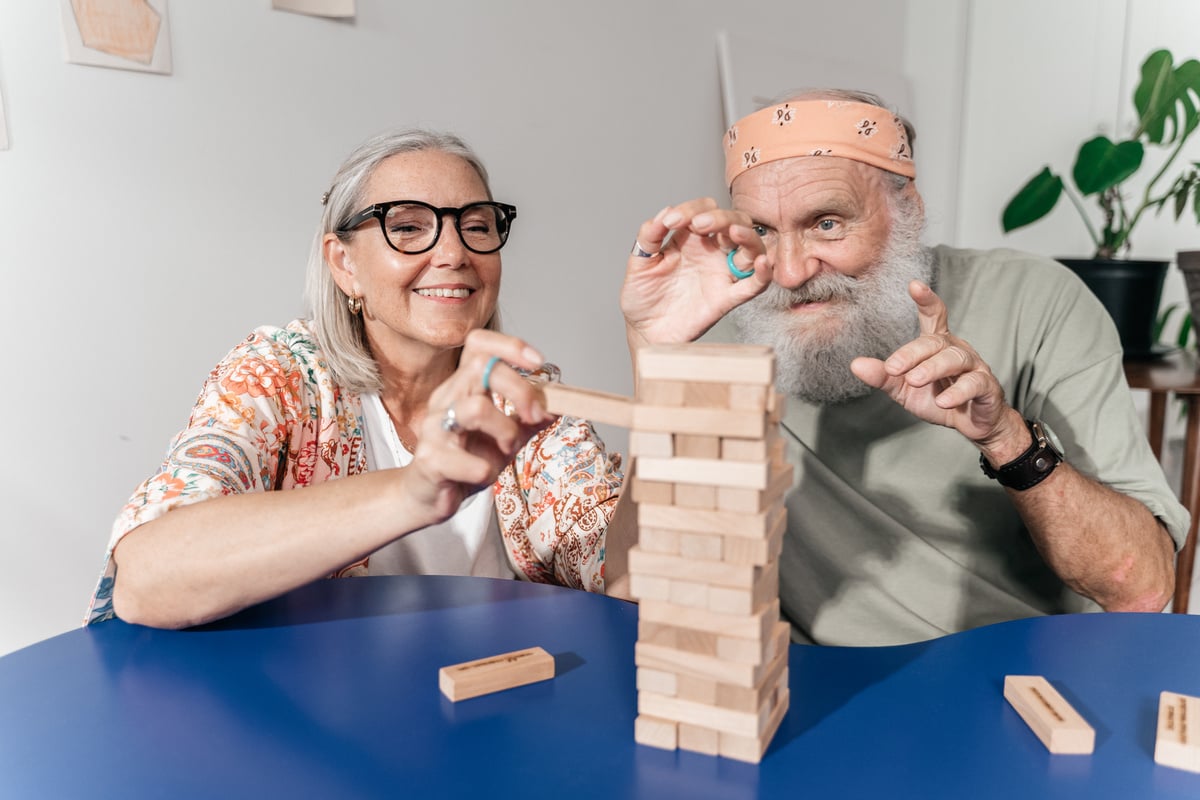 An Elderly Couple Playing Jenga